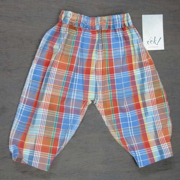 Beachcomber pants in red and blue retro plaid pattern, elastic waist, cuffed legs, size 6 months