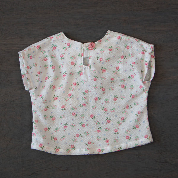 Child's vintage cotton top, white seersucker with pink rosebuds and a beautiful embroidered pocket, size 6 months