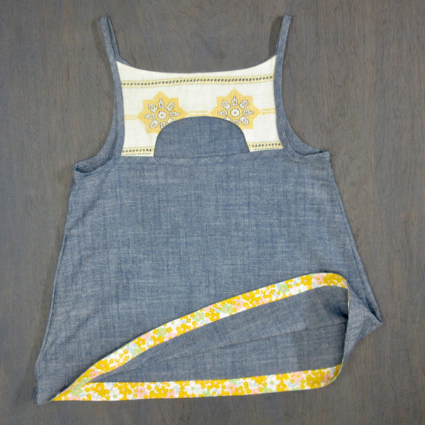 Child's reclaimed blue chambray cotton and cream and yellow vintage embroidery tank, with small embroidered pocket, size 8